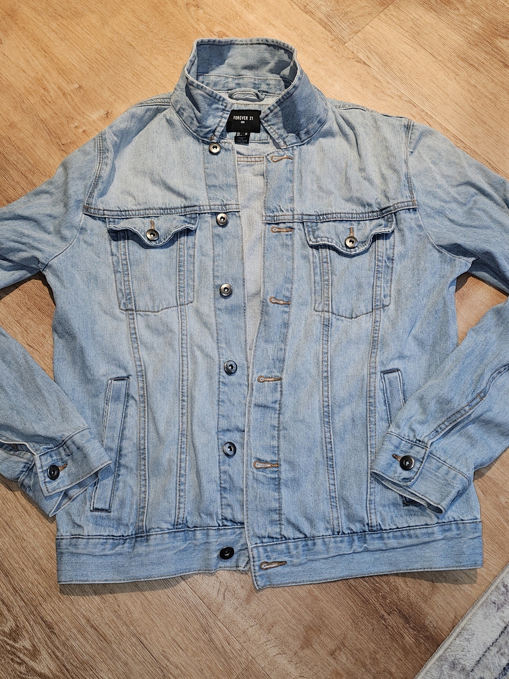 Forever 21 Men light wash denim jacket in size medium.